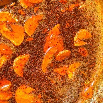 Kashmiri chili hot honey simmering in the sun