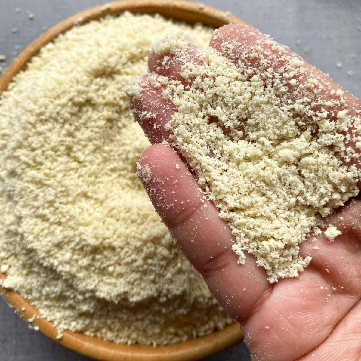 Cashew flour held in hands