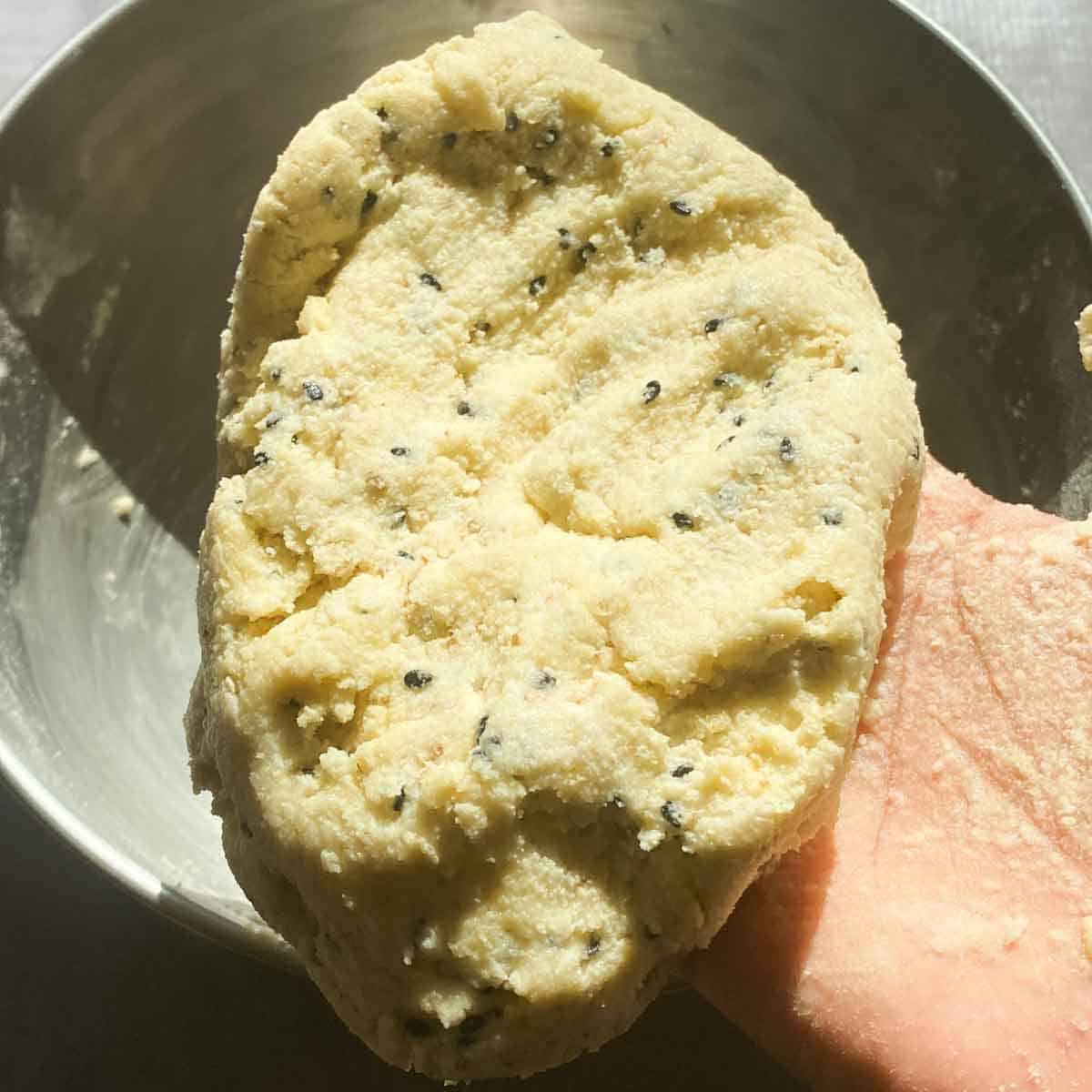 Murukku dough containing sesame seeds