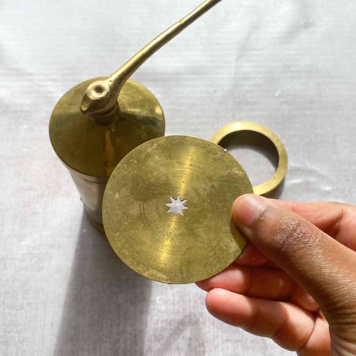 Murukku press with the star shaped plate shown