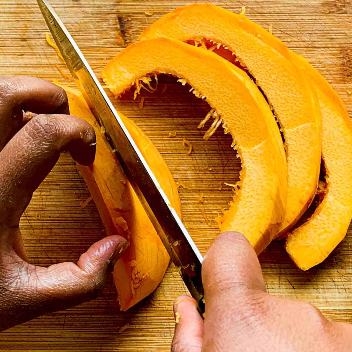 Pumpkin slices being cut
