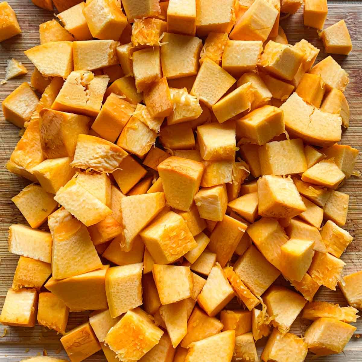 Pumpkin cubes on a cutting board