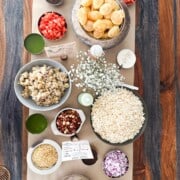 Overhead shot of a chaat-cuterie board with all of the ingredients to compose a chaat