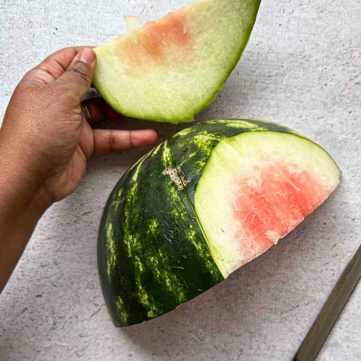 Removing the rid off a ¼ of the watermelon