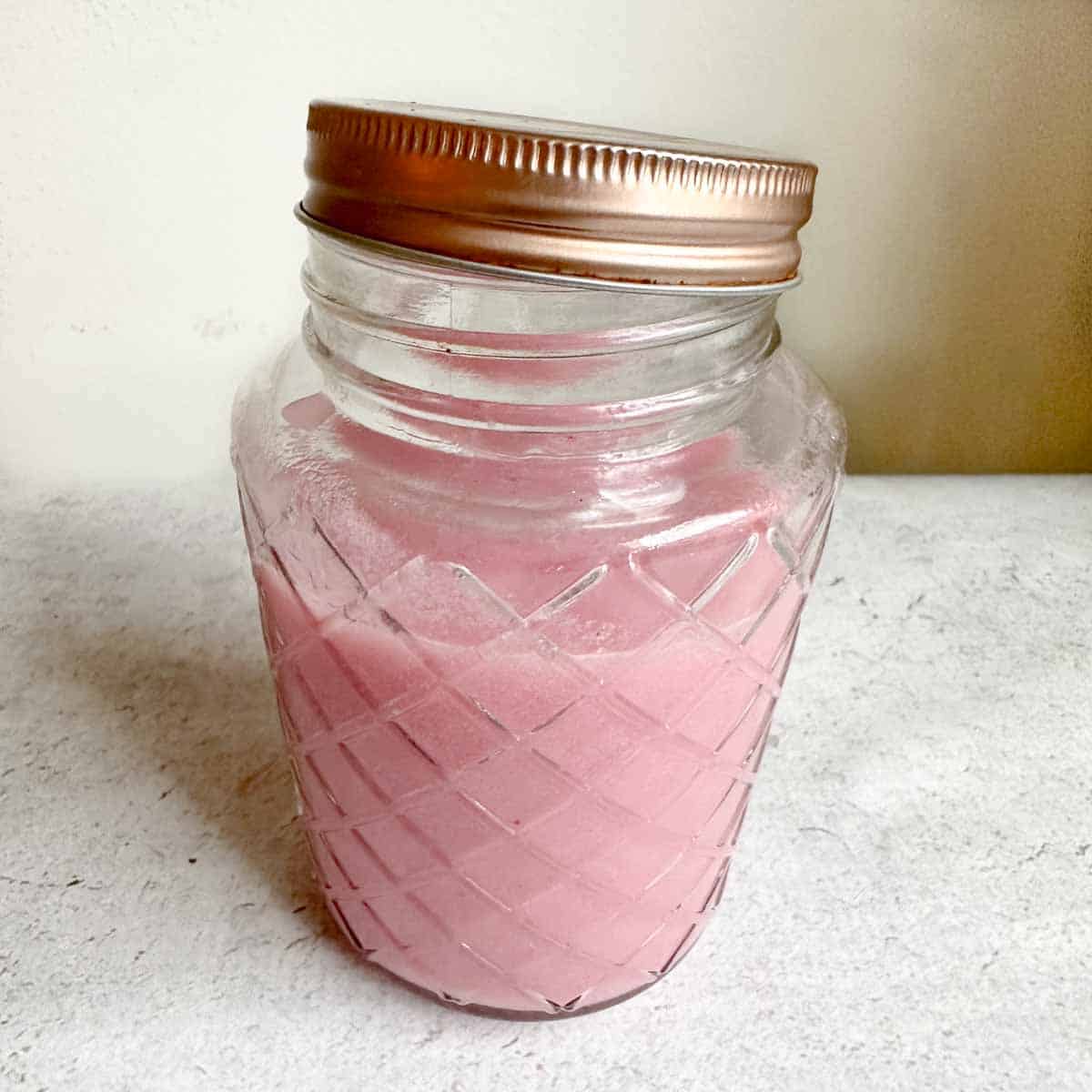 Lychee rose syrup in a glass mason jar