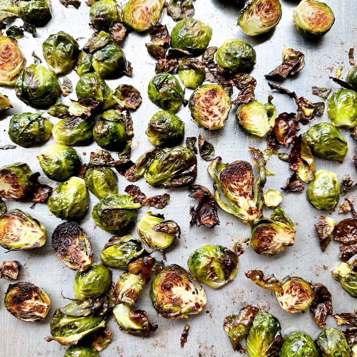 Roasted Brussels sprouts on a sheet tray.