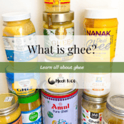 11 different ghee brand jars and 1 homemade ghee jar all lined up in a pyramid.