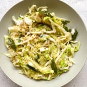 A gray bowl with cabbage poriyal or cabbage stir fry in it.
