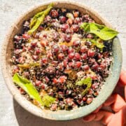 A bowl with kala chana sundal or sauteed black chickpeas with Indian spices in a small bowl.
