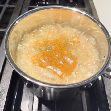 Pot with water coming to a vigorous boil.
