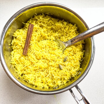 A pot of cooked Indian yellow basmati rice.