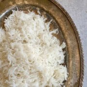 Fluffy stovetop basmati rice in a bronze platter.